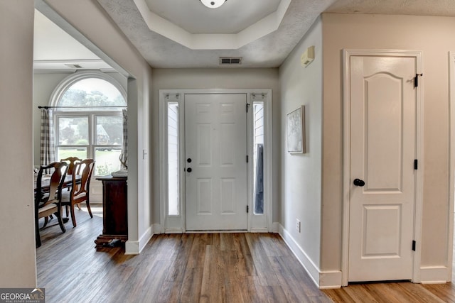 1882 Flowering Dr, Grayson, GA 30017 - entryway featuring wood finished floors, baseboards, and a tray ceiling