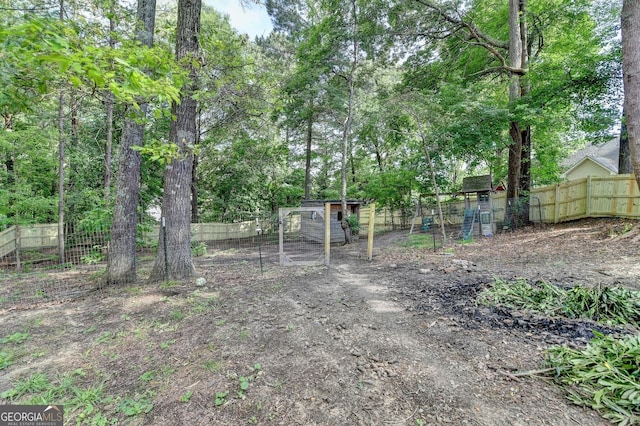 1882 Flowering Dr, Grayson, GA 30017 - fenced backyard with exterior structure and an outdoor structure