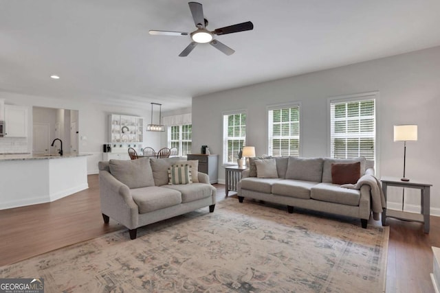 3980 Suwanee Place Dr, Suwanee, GA 30024 - living room with ceiling fan, wood finished floors, baseboards, and recessed lighting
