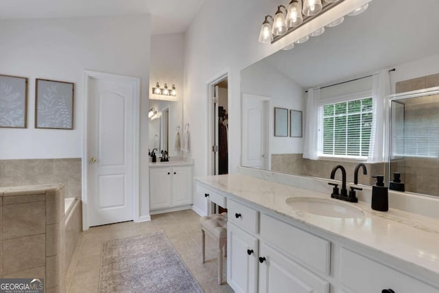 3980 Suwanee Place Dr, Suwanee, GA 30024 - bathroom with tile patterned flooring, two vanities, a bath, an enclosed shower, and a closet