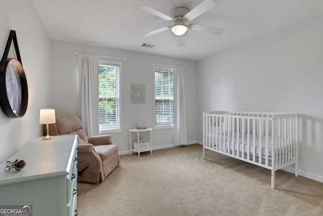 3980 Suwanee Place Dr, Suwanee, GA 30024 - bedroom featuring light colored carpet, a nursery area, and baseboards