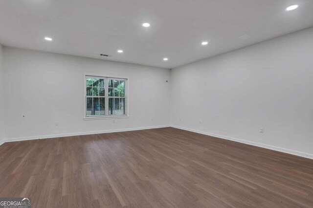 3980 Suwanee Place Dr, Suwanee, GA 30024 - spare room featuring wood finished floors, baseboards, and recessed lighting