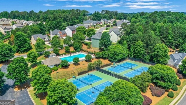 3980 Suwanee Place Dr, Suwanee, GA 30024 - aerial view of property's location with nearby suburban area and a pool