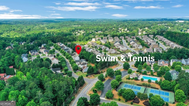 3980 Suwanee Place Dr, Suwanee, GA 30024 - aerial view of residential area featuring a forest and a pool area