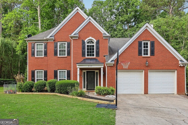 135 Clubhouse Dr NW, Kennesaw, GA 30144 - view of front of home with driveway, brick siding, a front lawn, a garage, and view of wooded area