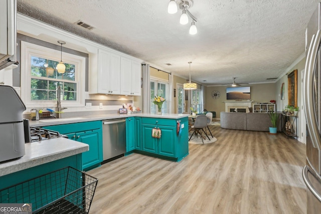 135 Clubhouse Dr NW, Kennesaw, GA 30144 - kitchen featuring stainless steel appliances, open floor plan, a sink, light wood-style floors, and healthy amount of natural light