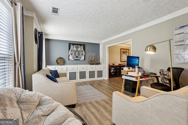 135 Clubhouse Dr NW, Kennesaw, GA 30144 - living area featuring wood finished floors, a textured ceiling, and crown molding