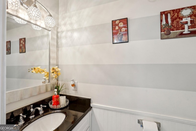 135 Clubhouse Dr NW, Kennesaw, GA 30144 - bathroom with vanity and a wainscoted wall
