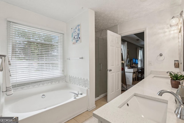 135 Clubhouse Dr NW, Kennesaw, GA 30144 - bathroom featuring double vanity, a bath, a stall shower, and tile patterned flooring
