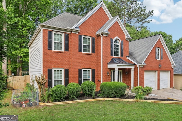 135 Clubhouse Dr NW, Kennesaw, GA 30144 - view of front of property with driveway, brick siding, a shingled roof, and a garage