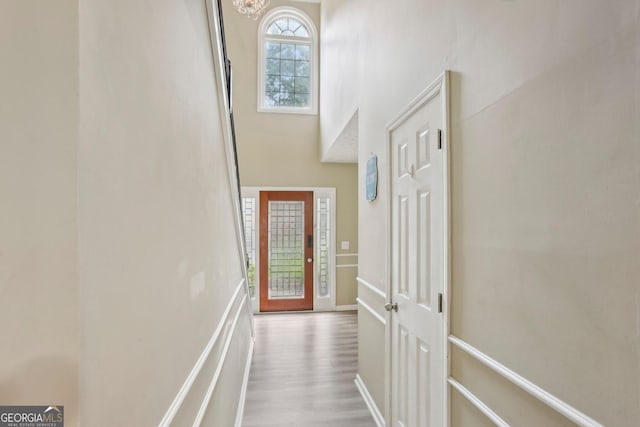 135 Clubhouse Dr NW, Kennesaw, GA 30144 - hall featuring a chandelier, wood finished floors, and a towering ceiling