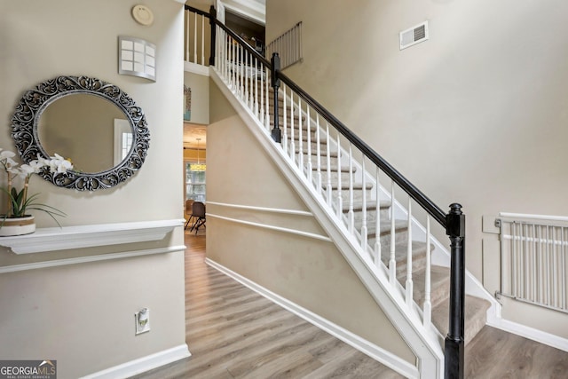 135 Clubhouse Dr NW, Kennesaw, GA 30144 - stairs with wood finished floors and baseboards