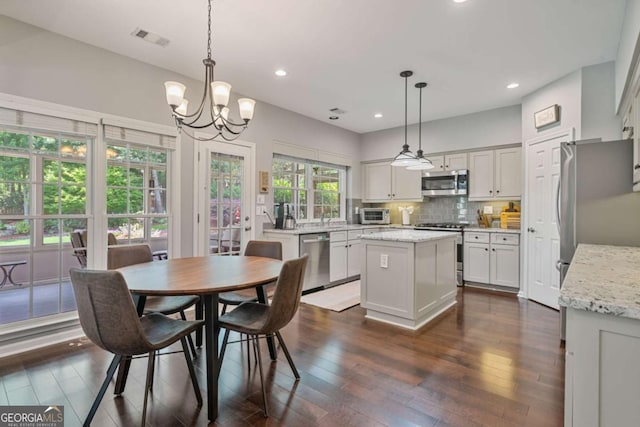 8045 Depford Way, Cumming, GA 30041 - dining room with recessed lighting, a chandelier, and dark wood-style floors