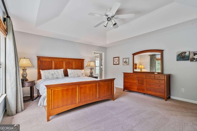 8045 Depford Way, Cumming, GA 30041 - bedroom with a tray ceiling, light carpet, baseboards, and a ceiling fan