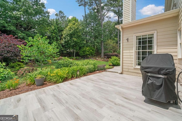 8045 Depford Way, Cumming, GA 30041 - wooden deck with area for grilling and view of wooded area