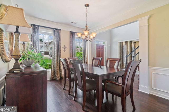 8045 Depford Way, Cumming, GA 30041 - dining area featuring a chandelier, dark wood-style floors, ornamental molding, and wainscoting