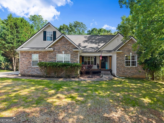 5995 Wellington Ave, Gainesville, GA 30506 - view of front of home featuring stone siding, a front yard, a porch, and a shingled roof
