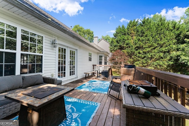 5995 Wellington Ave, Gainesville, GA 30506 - wooden terrace featuring french doors, outdoor dining area, and a fire pit