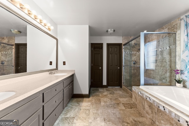 5995 Wellington Ave, Gainesville, GA 30506 - full bath featuring a stall shower, a bath, double vanity, baseboards, and stone finish floors