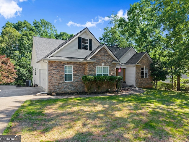 5995 Wellington Ave, Gainesville, GA 30506 - view of front of home with stone siding, an attached garage, a front yard, driveway, and cooling unit