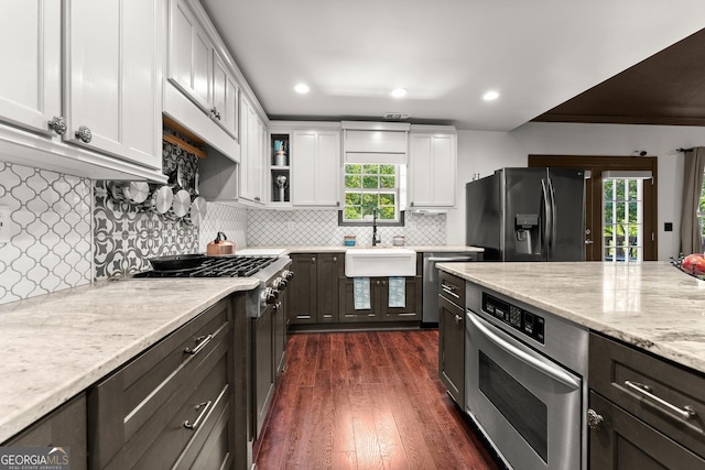 5995 Wellington Ave, Gainesville, GA 30506 - kitchen featuring stainless steel appliances, a sink, white cabinets, dark wood-type flooring, and light stone countertops
