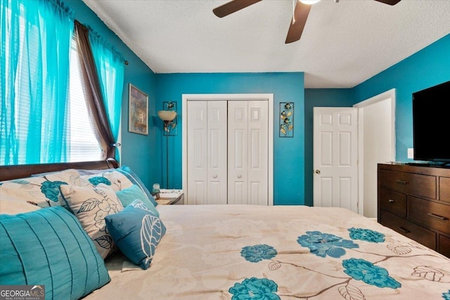 160 Country Mill Ln, Stockbridge, GA 30281 - bedroom featuring a closet, a textured ceiling, and ceiling fan