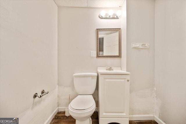 160 Country Mill Ln, Stockbridge, GA 30281 - half bathroom with baseboards, toilet, and vanity