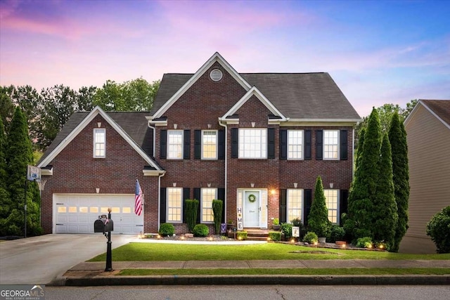 242 Sandhurst Ct, Suwanee, GA 30024 - view of front of house with driveway, brick siding, and a front yard