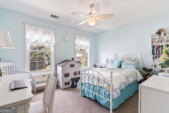 242 Sandhurst Ct, Suwanee, GA 30024 - bedroom with light colored carpet and ceiling fan