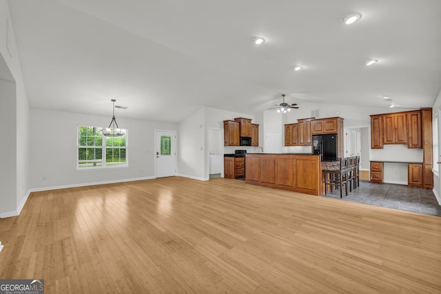 464 Old Camp Creek Rd, Cornelia, GA 30531 - unfurnished living room with lofted ceiling, light wood-type flooring, a ceiling fan, and baseboards