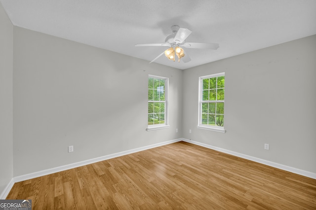 464 Old Camp Creek Rd, Cornelia, GA 30531 - empty room featuring baseboards, light wood finished floors, and ceiling fan