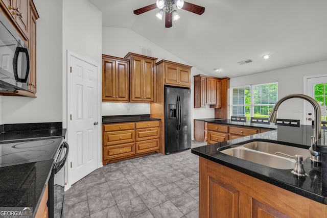 464 Old Camp Creek Rd, Cornelia, GA 30531 - kitchen featuring black appliances, a sink, vaulted ceiling, a ceiling fan, and brown cabinets