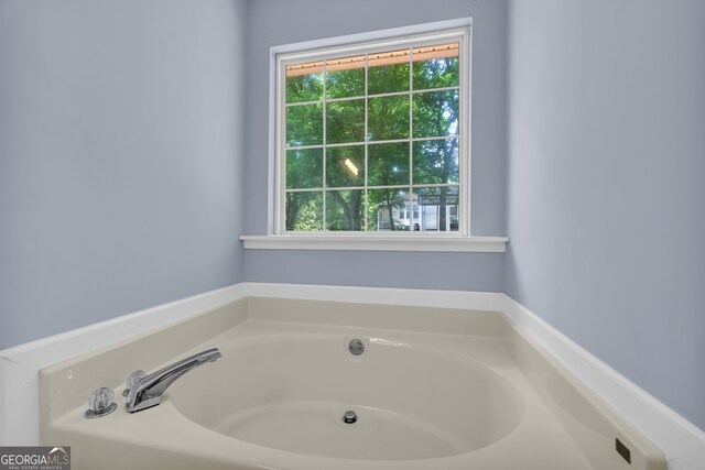 464 Old Camp Creek Rd, Cornelia, GA 30531 - bathroom with healthy amount of natural light and a garden tub