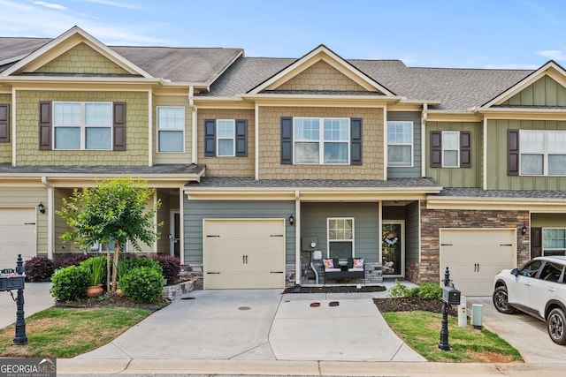 881 Ash St, Canton, GA 30114 - multi unit property with a garage, concrete driveway, a shingled roof, and stone siding