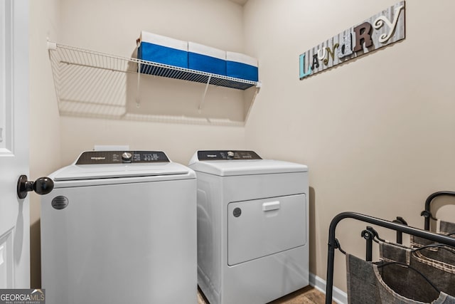 881 Ash St, Canton, GA 30114 - laundry room featuring washer and clothes dryer and baseboards