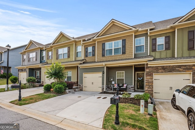 881 Ash St, Canton, GA 30114 - townhome / multi-family property featuring driveway, a garage, and stone siding