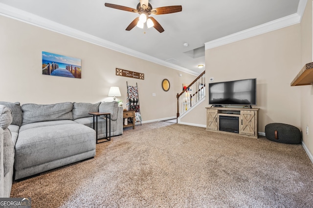 881 Ash St, Canton, GA 30114 - carpeted living area featuring ornamental molding, ceiling fan, stairway, and a fireplace