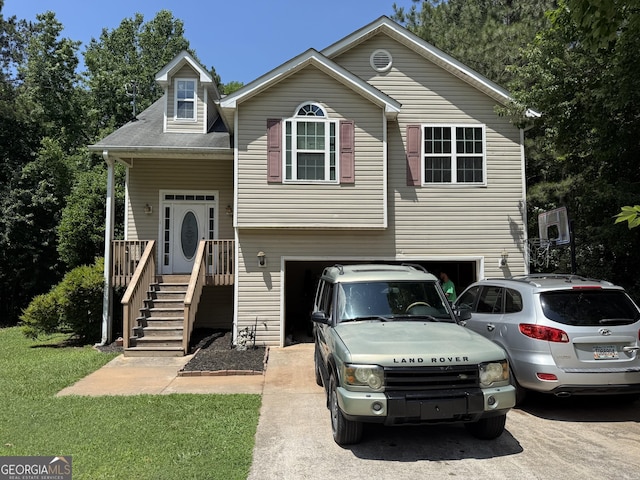 1432 Eagles Nest Cir, Carrollton, GA 30116 - view of front of property with a garage, asphalt driveway, and a front lawn