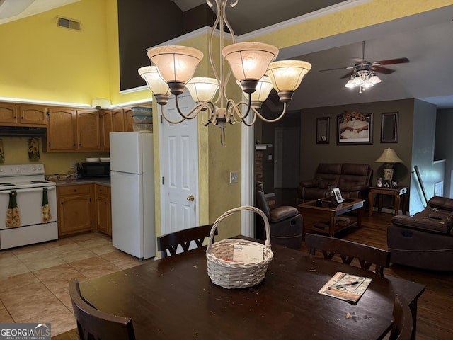 1432 Eagles Nest Cir, Carrollton, GA 30116 - dining room featuring a ceiling fan, a chandelier, and light tile patterned floors