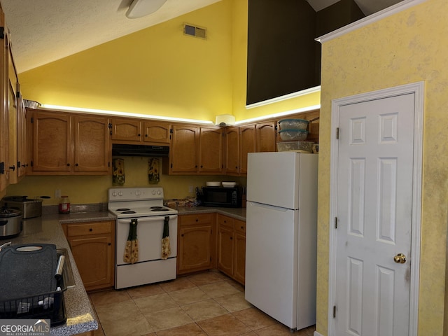 1432 Eagles Nest Cir, Carrollton, GA 30116 - kitchen featuring white appliances, vaulted ceiling, light tile patterned floors, extractor fan, and a textured ceiling