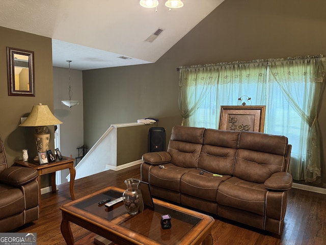 1432 Eagles Nest Cir, Carrollton, GA 30116 - living room with wood finished floors, vaulted ceiling, and baseboards
