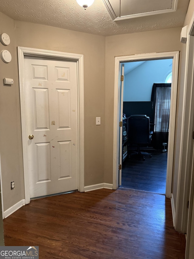 1432 Eagles Nest Cir, Carrollton, GA 30116 - corridor featuring dark wood-style floors, baseboards, a desk, and attic access