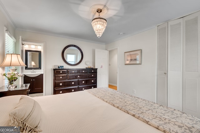 1448 Diamond Head Cir, Decatur, GA 30033 - bedroom with a chandelier, ornamental molding, ensuite bathroom, a sink, and a closet