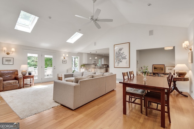 1448 Diamond Head Cir, Decatur, GA 30033 - living room with a skylight, light wood-style floors, and high vaulted ceiling