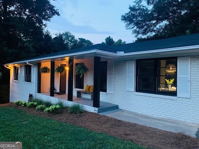 6715 Wright Rd, Sandy Springs, GA 30328 - view of front of house featuring brick siding and a porch
