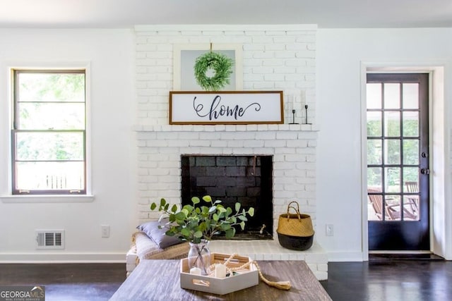 6715 Wright Rd, Sandy Springs, GA 30328 - living room with wood finished floors and a brick fireplace