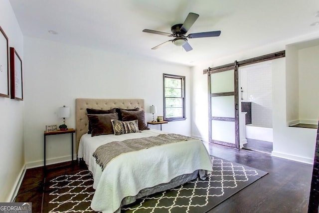 6715 Wright Rd, Sandy Springs, GA 30328 - bedroom with a barn door, wood finished floors, and a ceiling fan