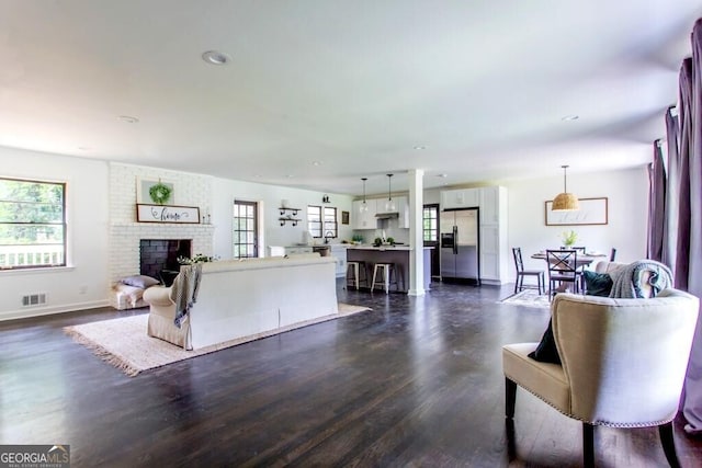 6715 Wright Rd, Sandy Springs, GA 30328 - living room with dark wood-style floors, a fireplace, and recessed lighting