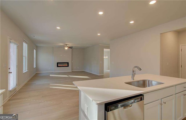 2525 Dixon Pl, Lawrenceville, GA 30045 - kitchen with dishwasher, a sink, a ceiling fan, recessed lighting, and white cabinetry
