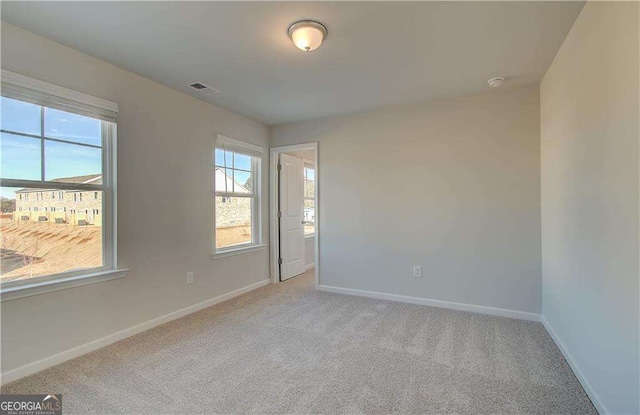 2525 Dixon Pl, Lawrenceville, GA 30045 - carpeted empty room featuring baseboards and a smoke detector